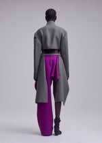A model wears the ISSEY MIYAKE CALLIGRAPH jacket.