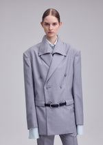 A model wears the ISSEY MIYAKE HONEST ENSEMBLE honest-ensemble-jacket-grey.