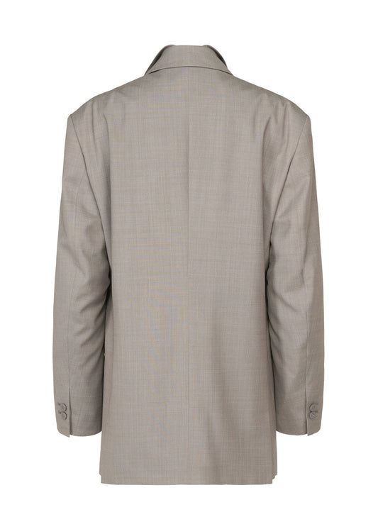 A detail shot of the ISSEY MIYAKE HONEST ENSEMBLE jacket.