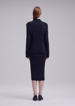 A model wears the ISSEY MIYAKE HATCHING PLEATS jacket.