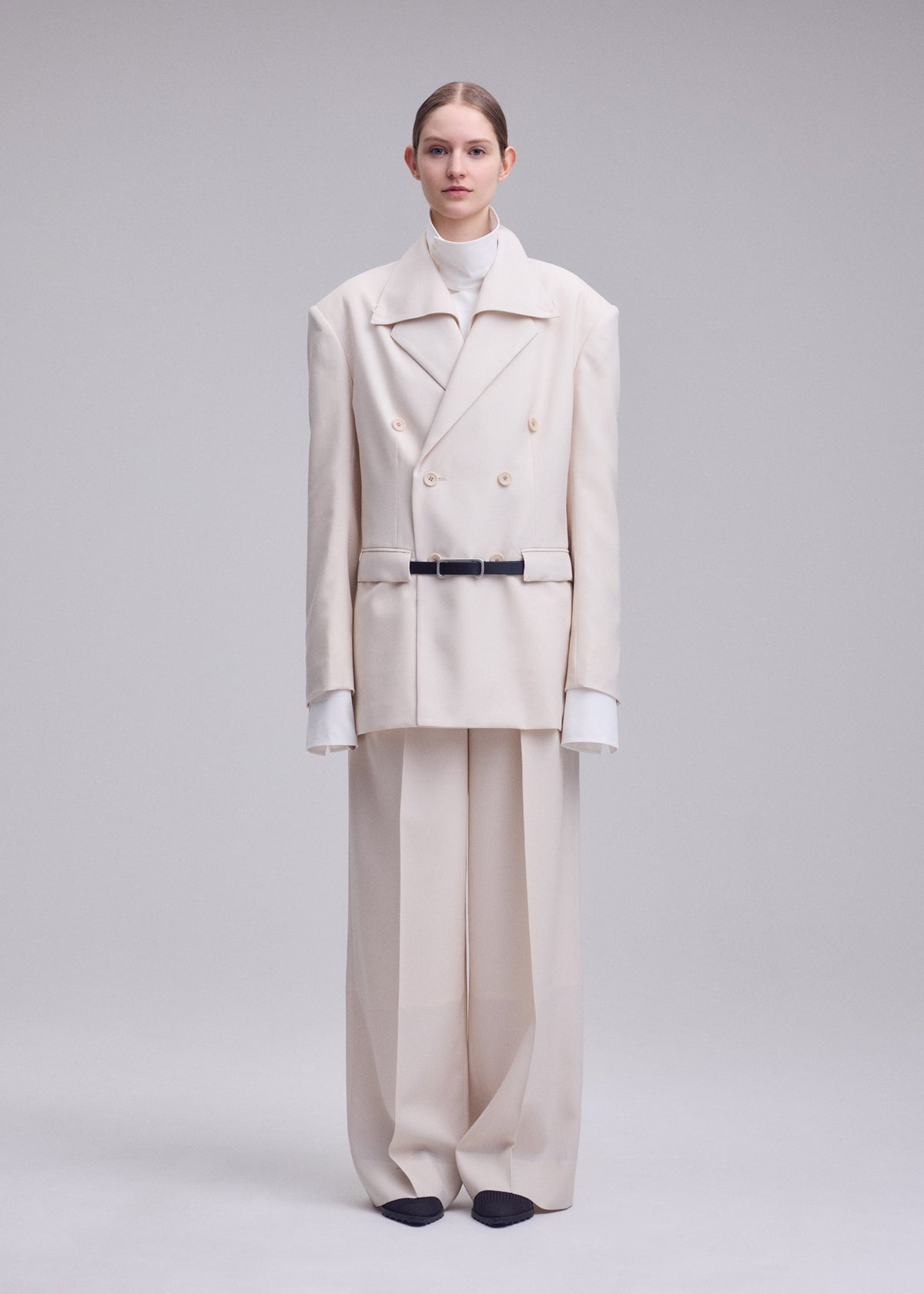A model wears the ISSEY MIYAKE UNTITLED trousers.