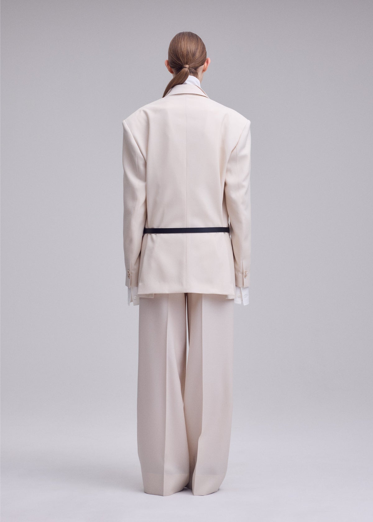 A model wears the ISSEY MIYAKE UNTITLED trousers.