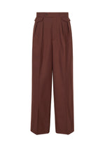 A product shot of the ISSEY MIYAKE UNTITLED trousers in brown.