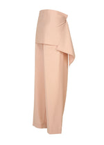 A detail shot of the ISSEY MIYAKE LUSTROUS WOOL PANTS trousers.