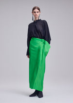 A model wears the ISSEY MIYAKE MERCURY mercury-skirt-dark-navy-1.