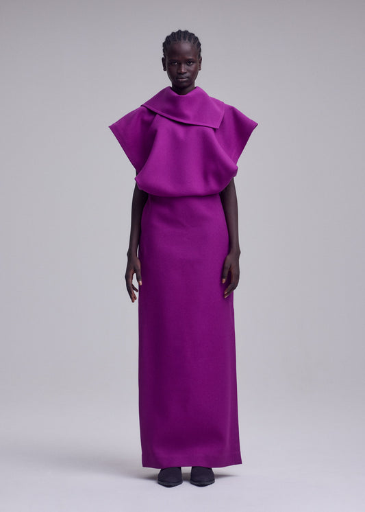 A model wears the ISSEY MIYAKE CALLIGRAPH dress.