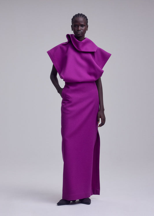 A model wears the ISSEY MIYAKE CALLIGRAPH dress.