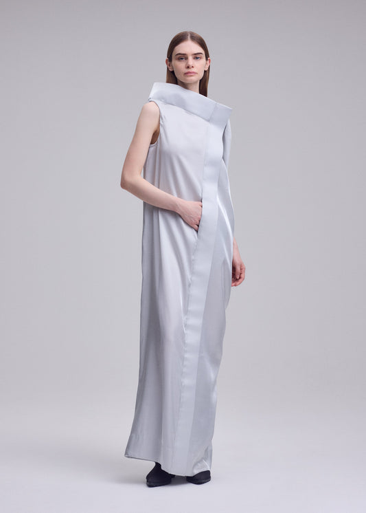A model wears the ISSEY MIYAKE MERCURY mercury-dress-light-grey.