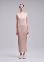 A model wears the ISSEY MIYAKE GLOSSED PANELS PLEATS glossed-panels-pleats-dress-grey.