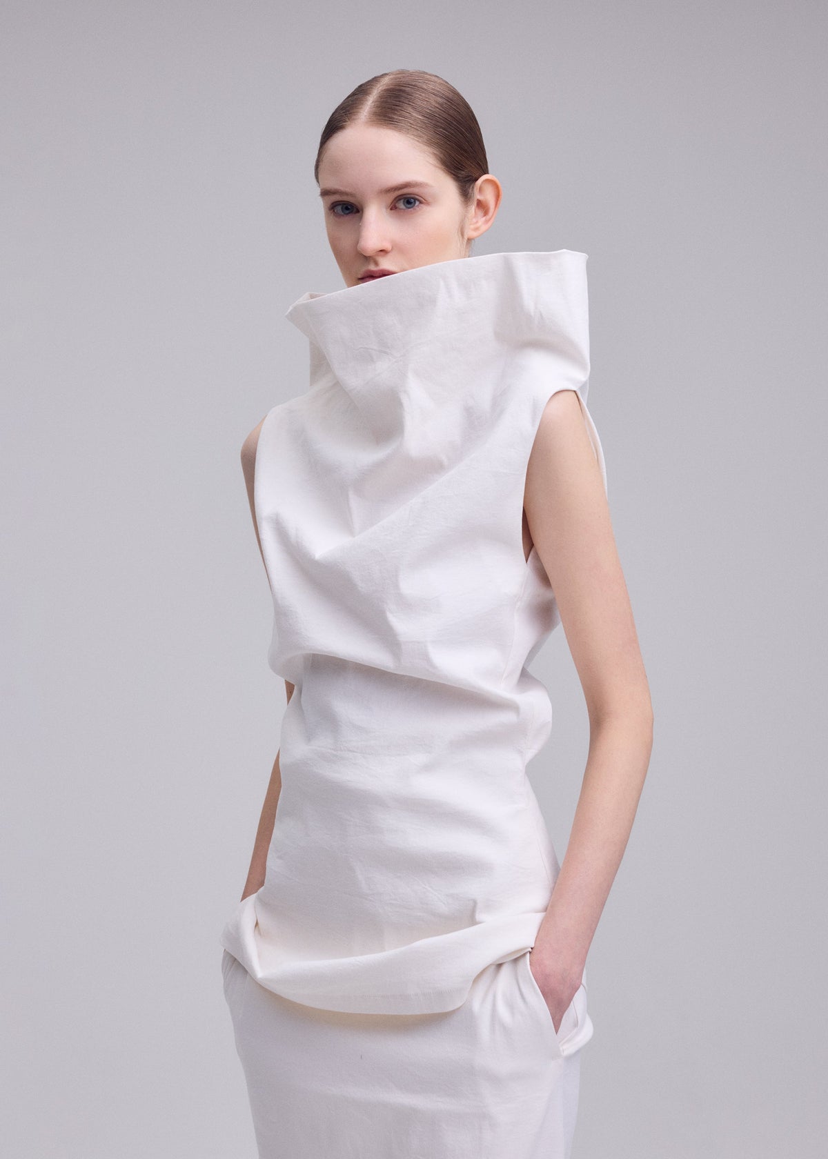 A model wears the ISSEY MIYAKE ALLOW allow-shirt-grey-1.