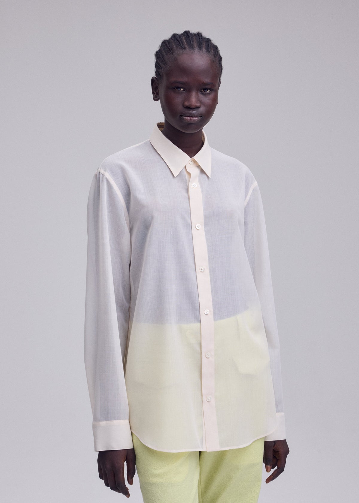 A model wears the ISSEY MIYAKE SHEER WOOL sheer-wool-shirt-dark-navy-2.