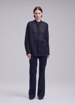 A model wears the ISSEY MIYAKE SHEER WOOL sheer-wool-shirt-black-4-fw26.