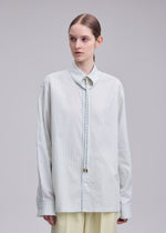 A model wears the ISSEY MIYAKE MONSIEUR SHIRT(DOBBY STRIPE) monsieur-shirt-dobby-stripe-shirt-black-hued-1.