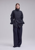 A model wears the ISSEY MIYAKE MONSIEUR SHIRT(DOBBY STRIPE) monsieur-shirt-dobby-stripe-shirt-white-hued.