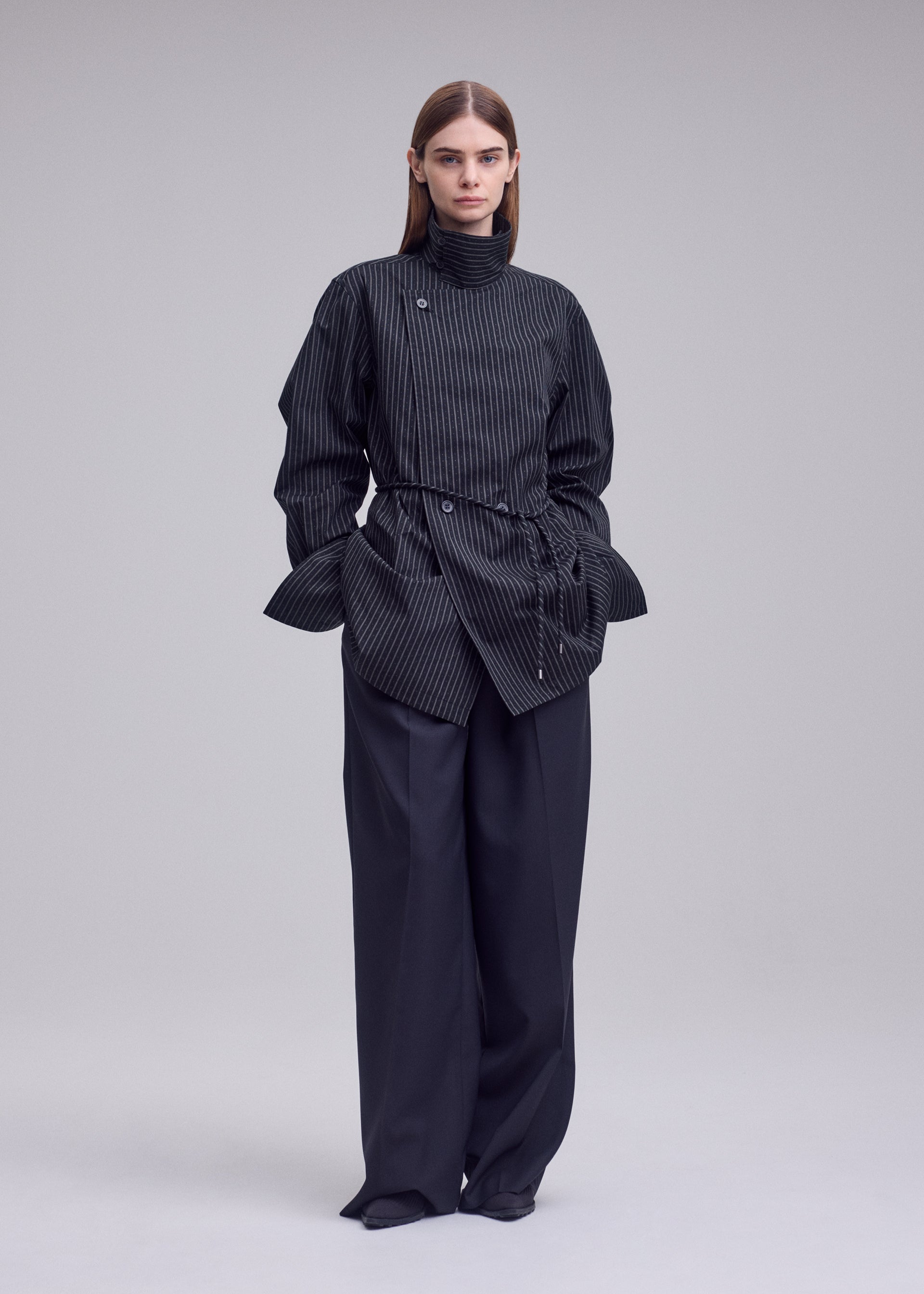 A model wears the ISSEY MIYAKE MONSIEUR SHIRT(DOBBY STRIPE) monsieur-shirt-dobby-stripe-shirt-white-hued.