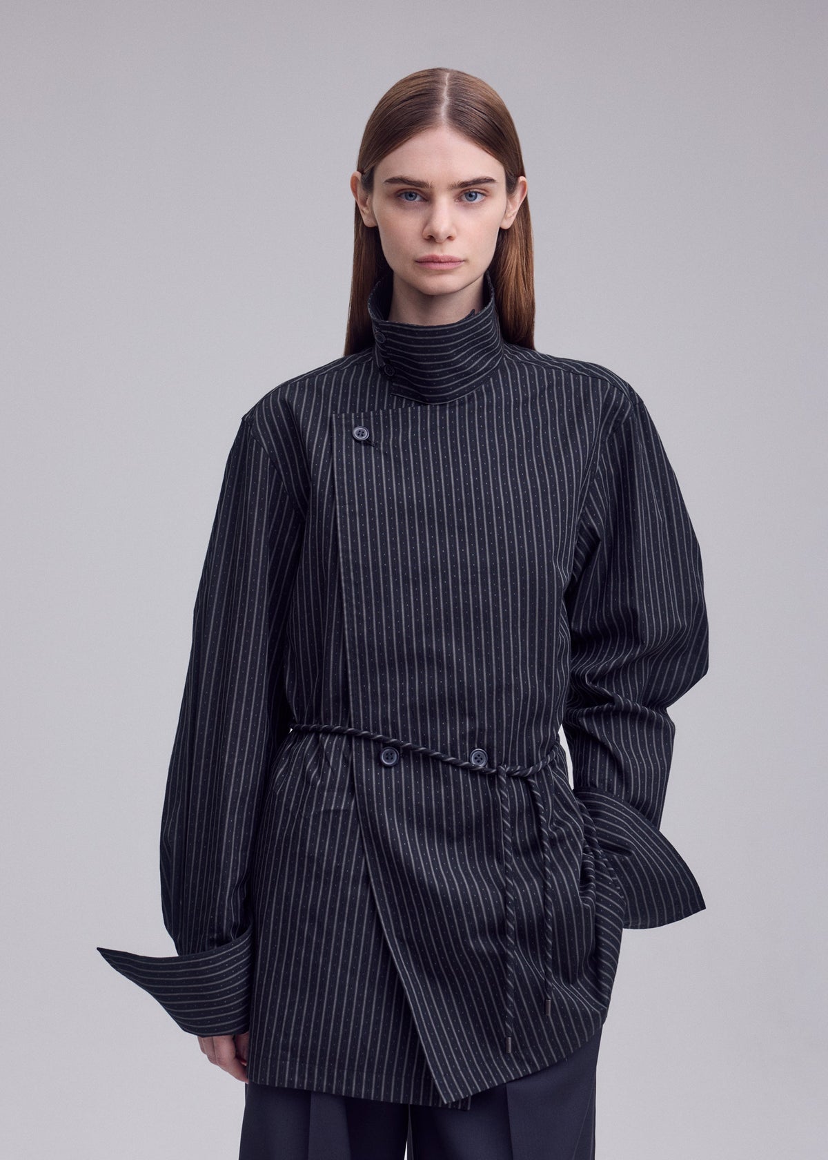 A model wears the ISSEY MIYAKE MONSIEUR SHIRT(DOBBY STRIPE) monsieur-shirt-dobby-stripe-shirt-white-hued.
