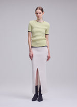 A model wears the ISSEY MIYAKE RILL rill-shirt-off-white-2.