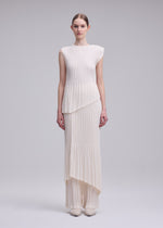 A model wears the ISSEY MIYAKE UNFURLING PLEATS unfurling-pleats-shirt-green-1.