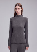 A model wears the ISSEY MIYAKE HATCHING PLEATS shirt.