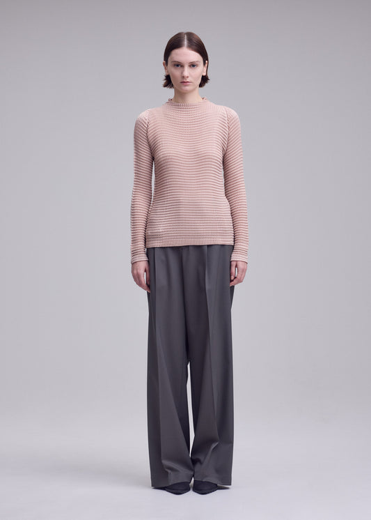 A model wears the ISSEY MIYAKE SUEDE LIKE PLEATS suede-like-pleats-shirt-grey-1.