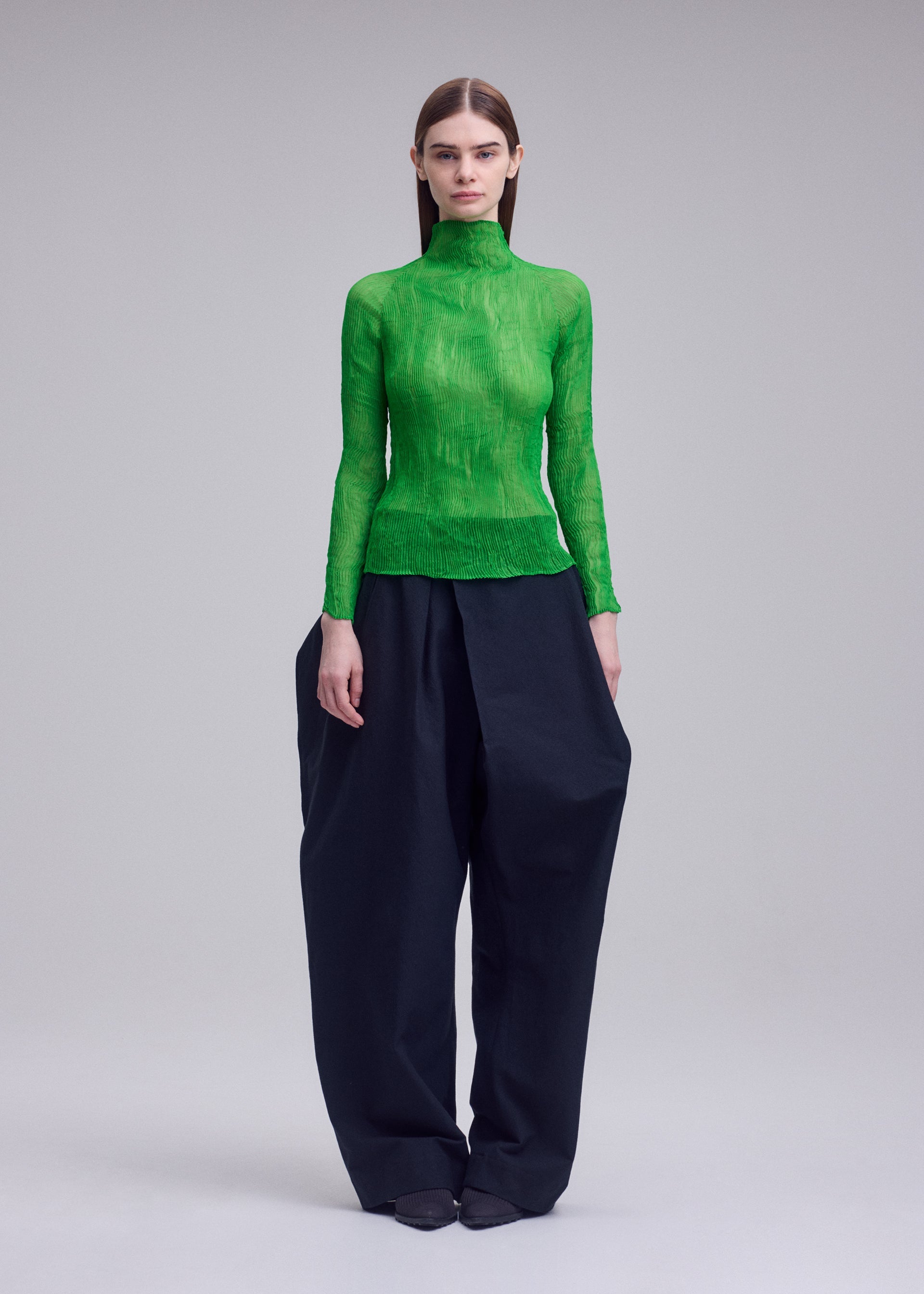 A model wears the ISSEY MIYAKE CHIFFON TWIST 1 chiffon-twist-1-shirt-green-4.