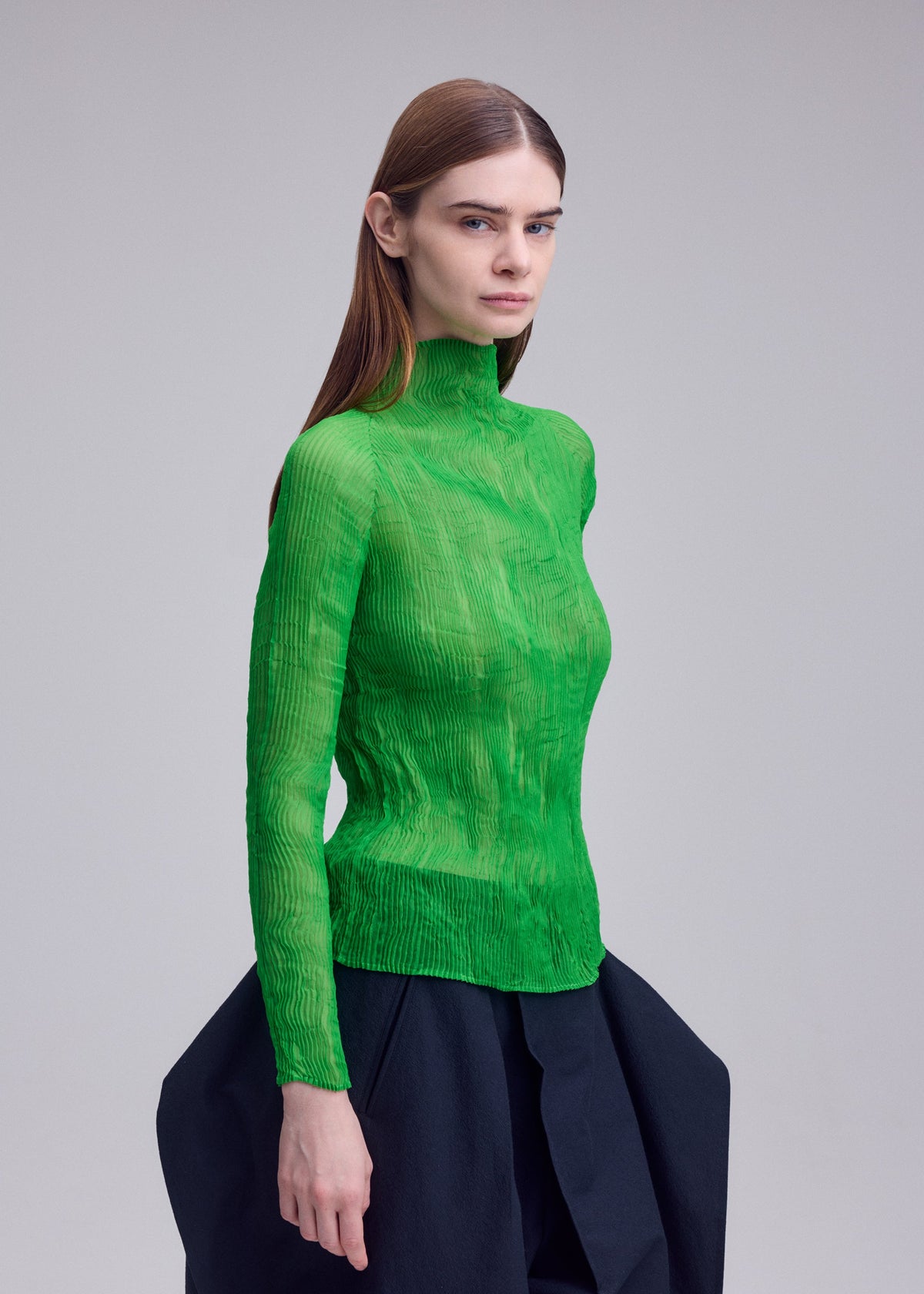 A model wears the ISSEY MIYAKE CHIFFON TWIST 1 chiffon-twist-1-shirt-green-4.