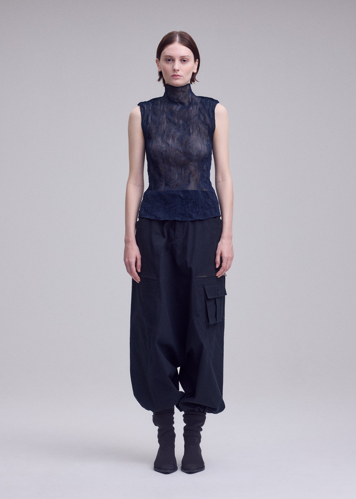 A model wears the ISSEY MIYAKE CHIFFON TWIST 1 chiffon-twist-1-shirt-light-blue-7.