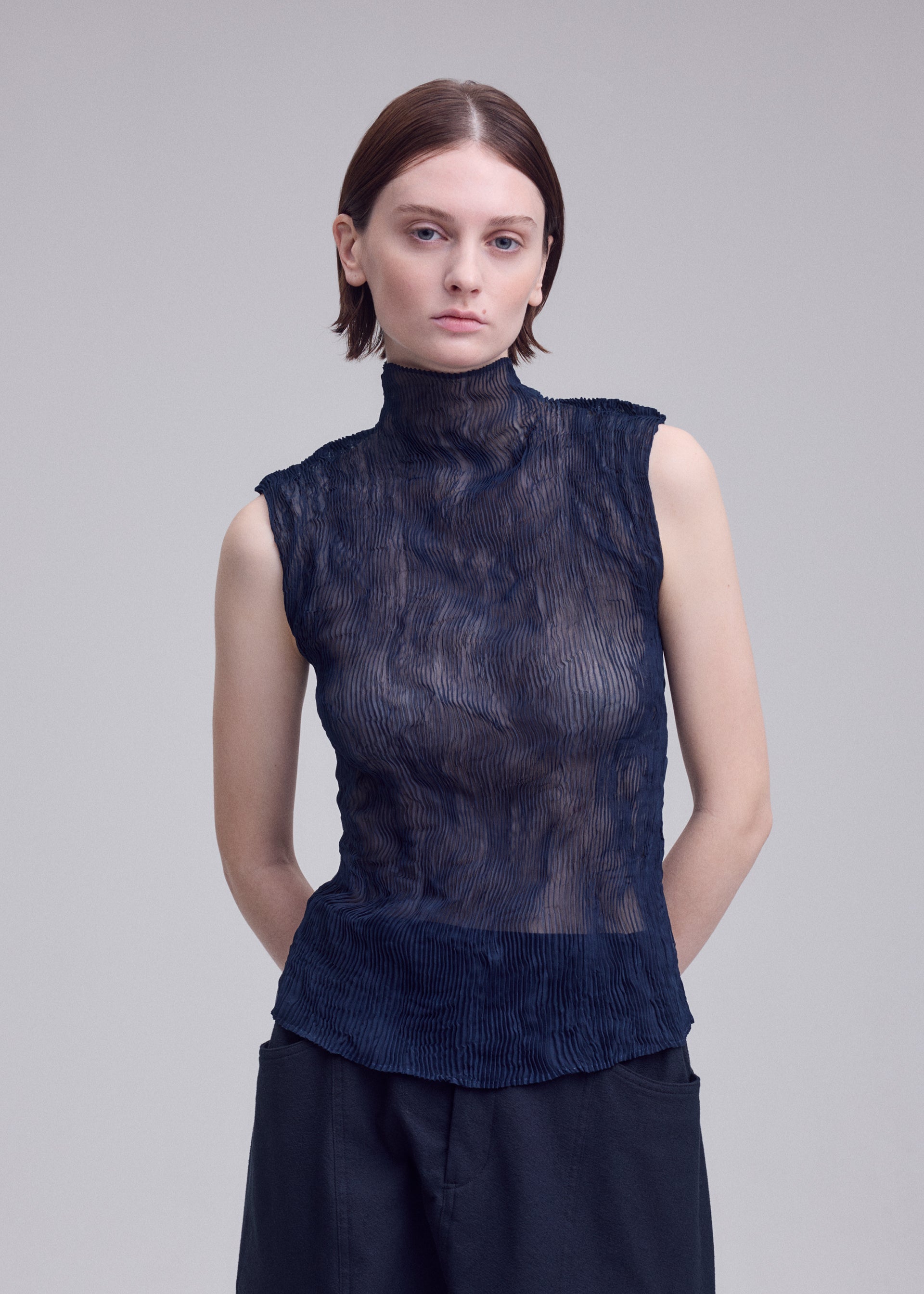 A model wears the ISSEY MIYAKE CHIFFON TWIST 1 chiffon-twist-1-shirt-dark-navy-8.