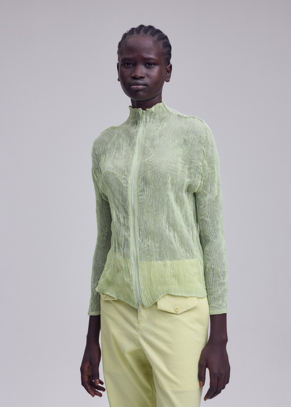 A model wears the ISSEY MIYAKE CHIFFON TWIST 1 chiffon-twist-1-shirt-green-9.