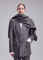 A model wears the ISSEY MIYAKE MANNER jacket.