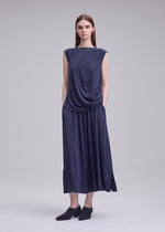 A model wears the ISSEY MIYAKE DRAPE JERSEY-68 drape-jersey-68-trousers-black-1.