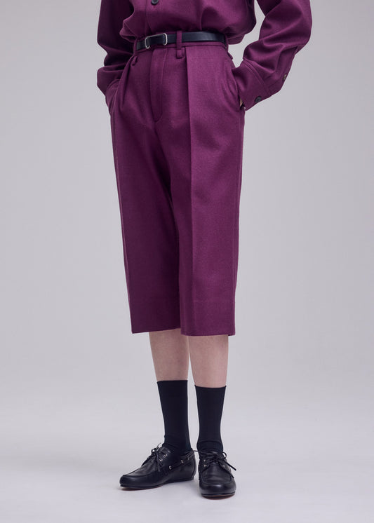 A model wears the ISSEY MIYAKE MANNER trousers.