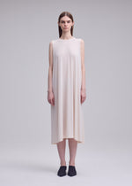 A model wears the ISSEY MIYAKE DRAPE JERSEY-68 drape-jersey-68-dress-dark-navy-2.