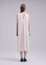 A model wears the ISSEY MIYAKE DRAPE JERSEY-68 drape-jersey-68-dress-black-1.