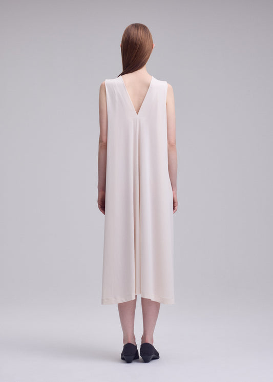 A model wears the ISSEY MIYAKE DRAPE JERSEY-68 drape-jersey-68-dress-black-1.