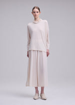 A model wears the ISSEY MIYAKE DRAPE JERSEY-68 drape-jersey-68-shirt-dark-navy-5.