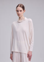 A model wears the ISSEY MIYAKE DRAPE JERSEY-68 drape-jersey-68-shirt-off-white-3.