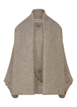 A product shot of the ISSEY MIYAKE WOOLEN GRANITE coat in beige.