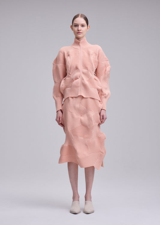 A model wears the ISSEY MIYAKE KONE KONE jacket.