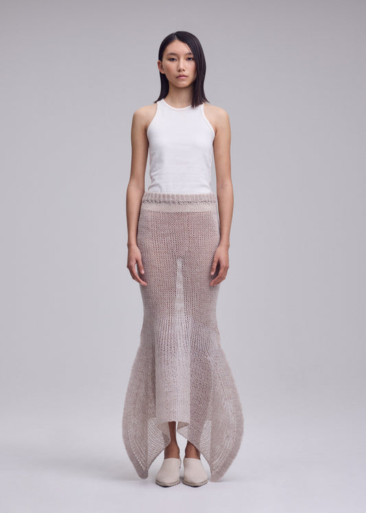 A model wears the ISSEY MIYAKE PANINI PULLED skirt.