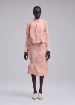 A model wears the ISSEY MIYAKE KONE KONE skirt.