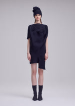 A model wears the ISSEY MIYAKE FOUND STONE found-stone-dress-off-white.