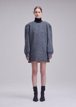 A model wears the ISSEY MIYAKE HANDSOME KNIT handsome-knit-dress-off-white.