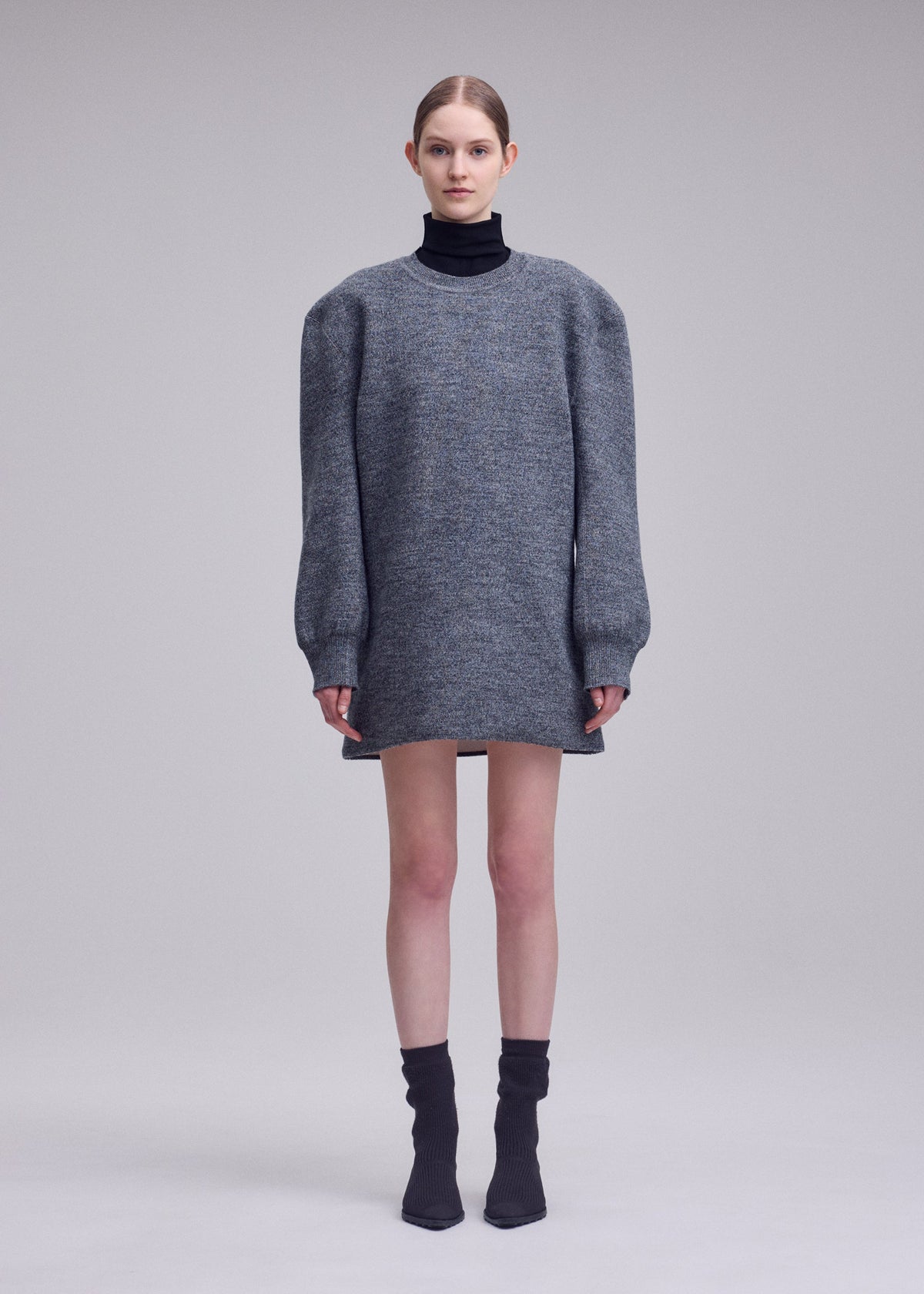 A model wears the ISSEY MIYAKE HANDSOME KNIT handsome-knit-dress-off-white.