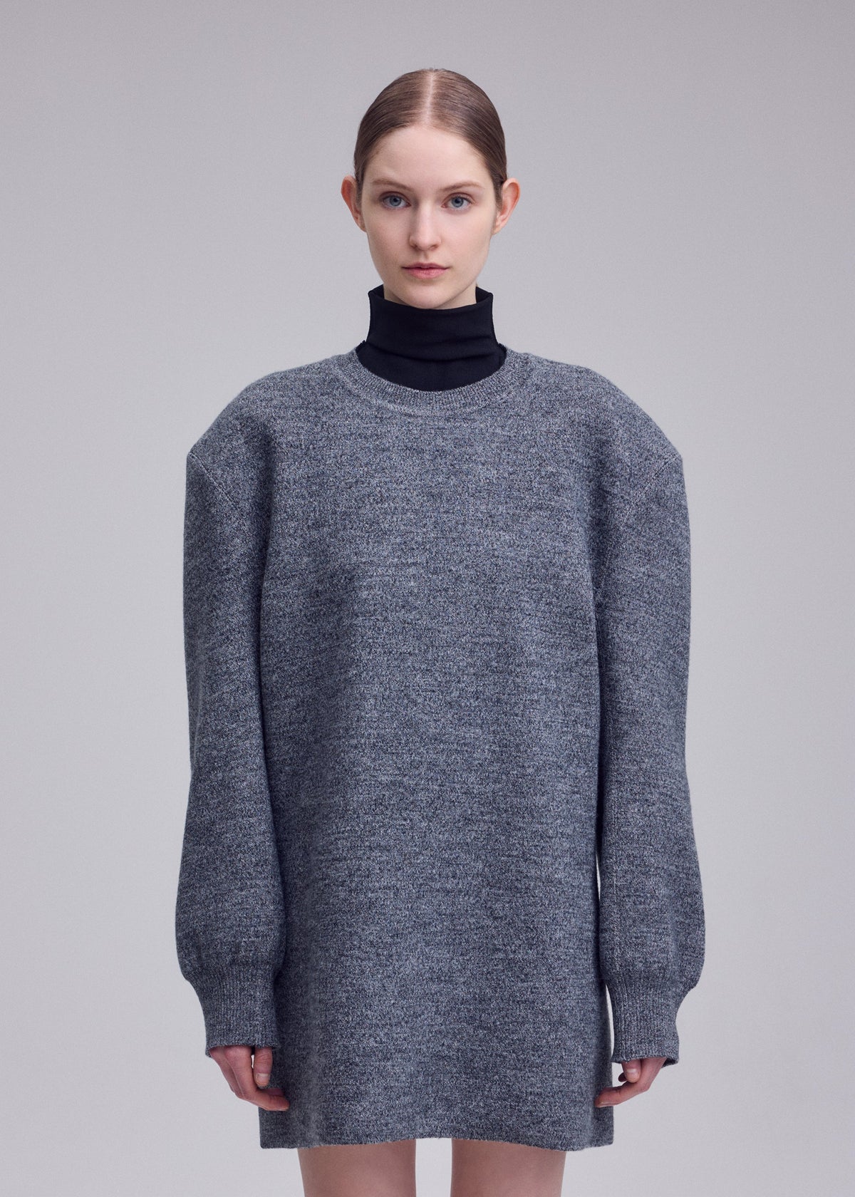 A model wears the ISSEY MIYAKE HANDSOME KNIT dress.