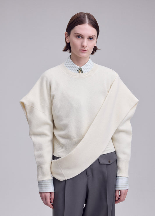 A model wears the ISSEY MIYAKE O KNIT top.