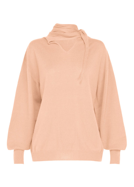 A product shot of the ISSEY MIYAKE SILK CASHMERE KNIT top in light pink.