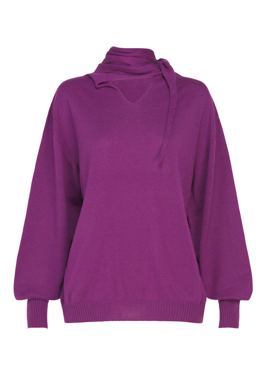 A product shot of the ISSEY MIYAKE SILK CASHMERE KNIT top in purple.