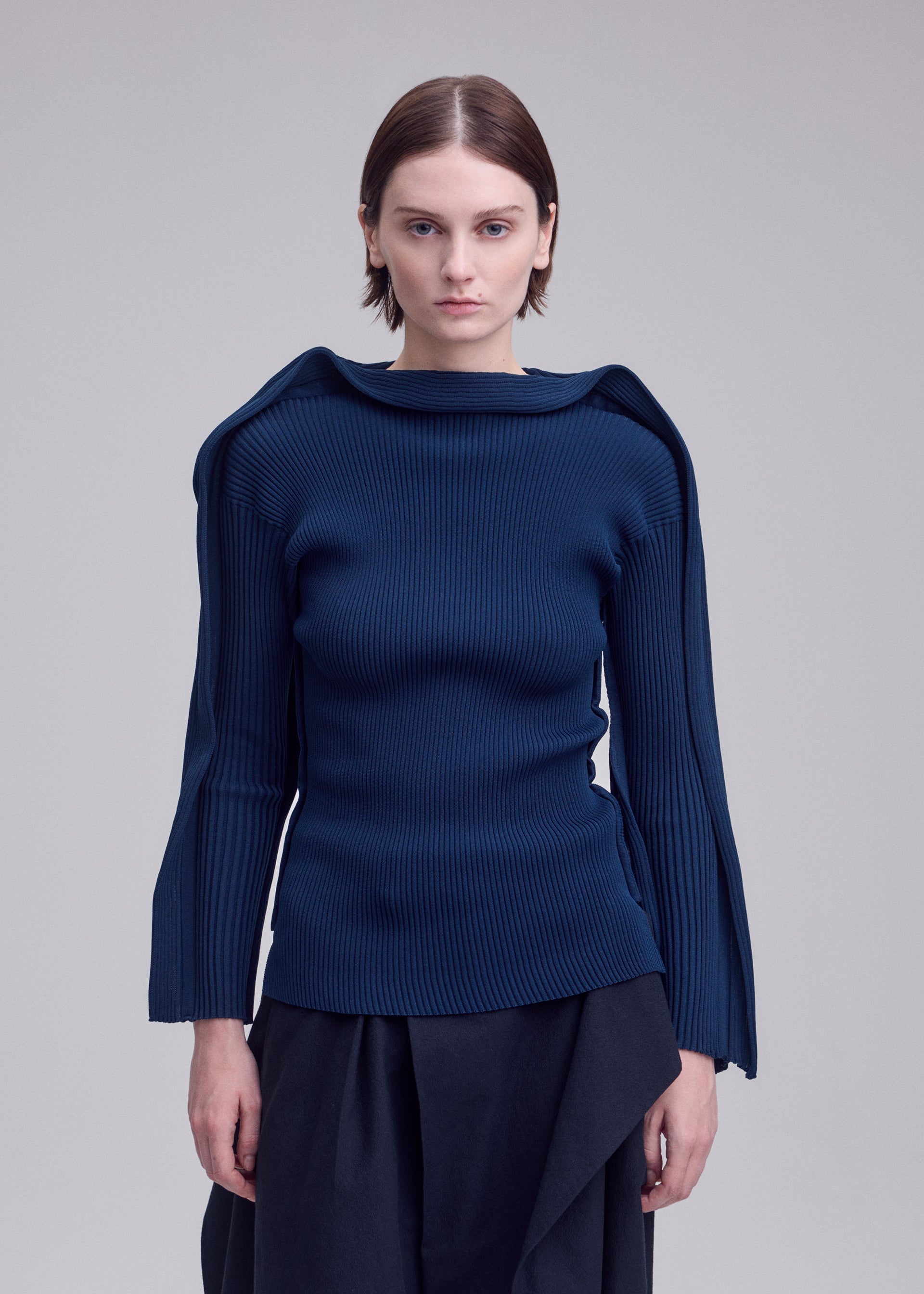 A model wears the ISSEY MIYAKE PRANCE prance-top-ivory-1.