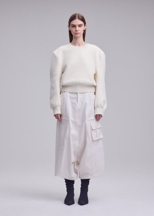 A model wears the ISSEY MIYAKE HANDSOME KNIT handsome-knit-top-black.